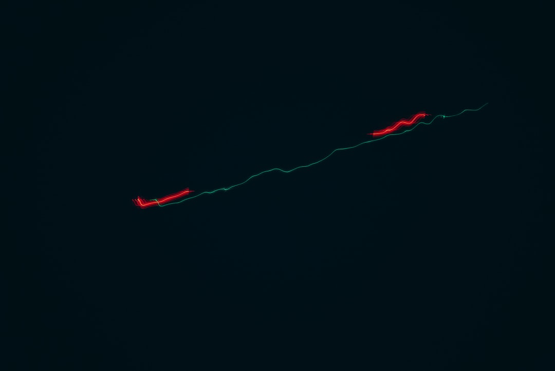 A long shutter speed shot of a flying plane at night